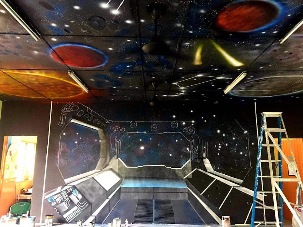 Once the ceiling was done, Cikgu Farra began working on the spaceship detailing on the walls. — Picture via Facebook/Cikgu Farra.