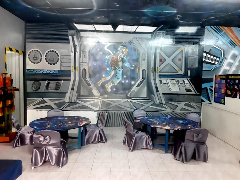 There’s even a life-sized astronaut hopping out into space painted on one of the walls. — Picture via Facebook/Cikgu Farra.