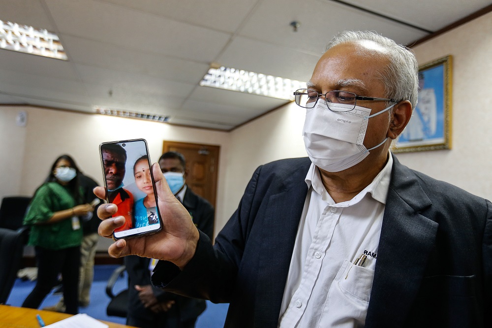 Penang Deputy Chief Minister P. Ramasamy shows a picture of one of the stateless students on his mobile phone during a press conference in George Town February 2, 2021. u00e2u20acu201d Picture by Sayuti Zainudin