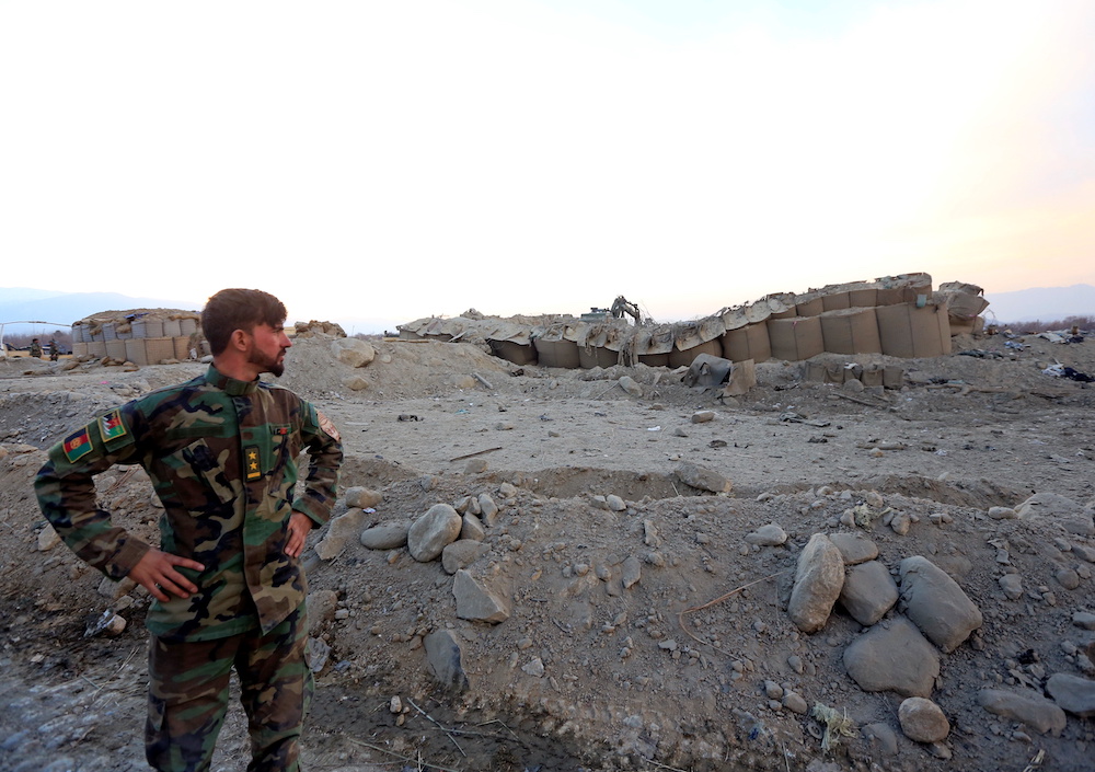 An Afghan National Army soldier inspects the site of a car bomb attack on a military base in Shirzad district of Nangarhar province, Afghanistan January 30, 2021. u00e2u20acu201d Reuters pic