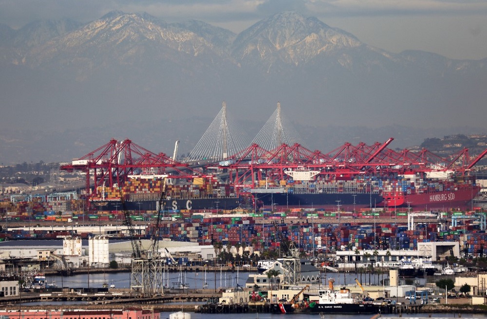 Container ships and shipping containers (centre) are viewed at the Port of Los Angeles with the Port of Long Beach in the distance in San Pedro, California February 1, 2021. u00e2u20acu201d AFP pic
