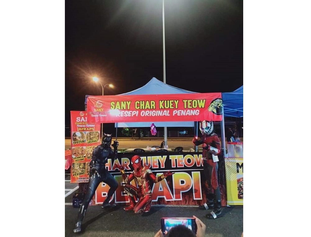 The superhero costumes help to attract customers. u00e2u20acu201d Picture courtesy of Norazrena Mardeka Mohd Daim
