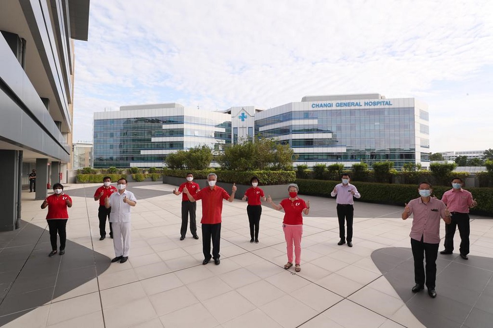 Prime Minister Lee Hsien Loong and his wife Ho Ching with staff from Changi General Hospital, during a Chinese New Year visit to workers, in Singapore February 12, 2021. u00e2u20acu201d TODAY pic
