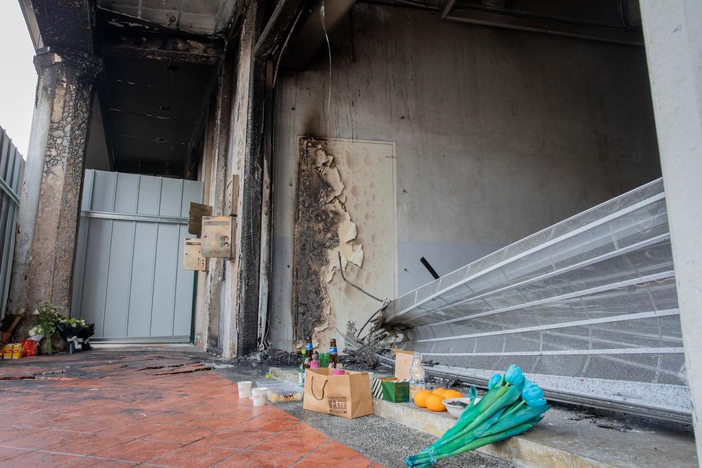 Flowers and offerings such as oranges and packet drinks were seen at the accident site on Sunday, before it was cordoned off to the public. u00e2u20acu201d TODAY pic