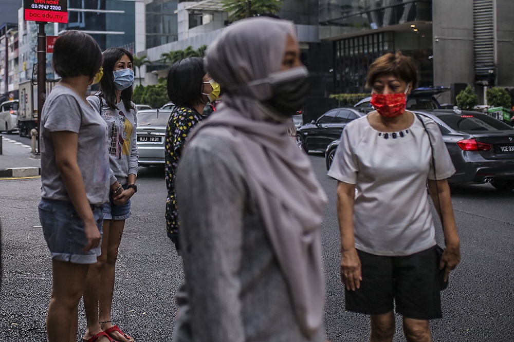People were face masks during the movement control order, in Kuala Lumpur city centre February 16, 2021. u00e2u20acu201d Picture by Hari Anggara