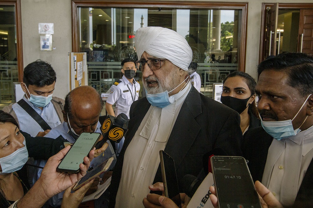 Datuk Jagjit Singh (left) and Lawyer Datuk Akberdin Abdul Kader (right) speak to the press at the Kuala Lumpur Court Complex February 18, 2021. u00e2u20acu201d Picture by Firdaus Latif 