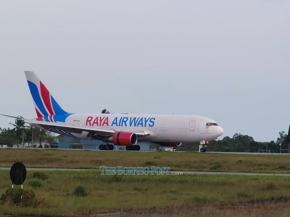 The Raya Airways plane carrying the first batch of vaccines for frontliners touches down at Kuching International Airport. u00e2u20acu201d Picture by Chimon Upon via Borneo Post Online