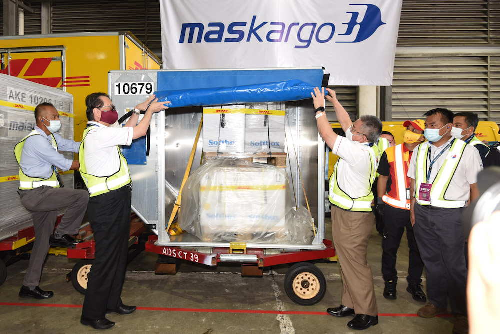 Health Director-General Tan Sri Dr Noor Hisham Abdullah and Health Minister Datuk Seri Dr Adham Baba with the Pfizer-BioNTech Covid-19 vaccine shipment. u00e2u20acu201d Picture courtesy of Jabatan Penerangan Malaysia