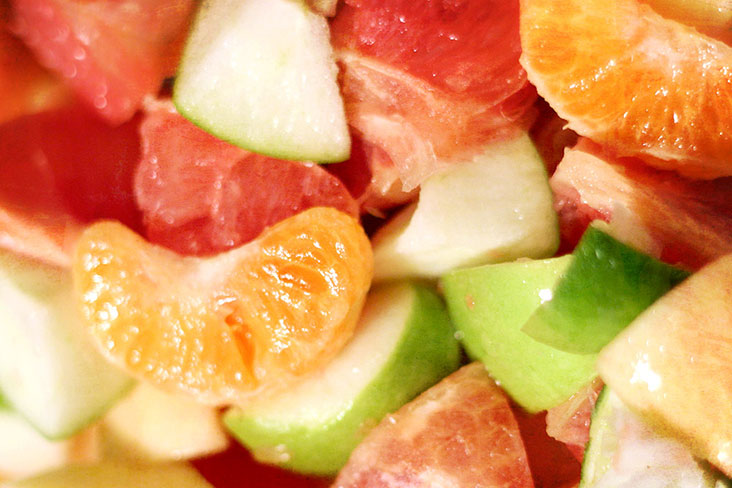 The base of the salad – mandarin oranges and other fruits.