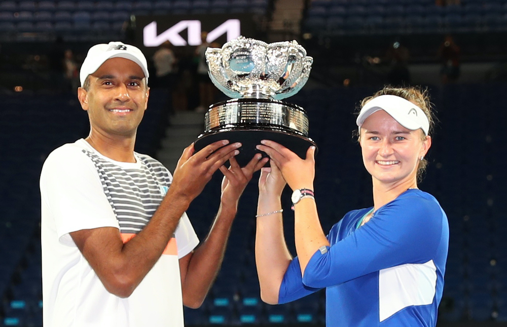 Rajeev Ram of the US and Czech Republic's Barbora Krejcikova pose with the trophy after winning their mixed doubles final against Australia's Matthew Ebden and Samantha Stosur at the Mixed Doubles Final at Melbourne Park in Melbourne, February 20, 2021. u00e2
