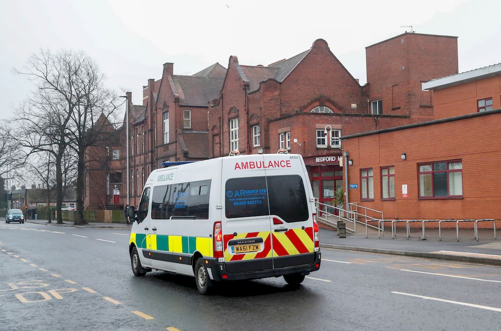 An ambulance rides in front of Bedford Hospital as Britainu00e2u20acu2122s centenarian fundraiser Captain Sir Tom Moore is taken to a hospital after testing positive for Covid-19 during treatment for pneumonia, in Bedford, Britain, February 1, 2021. u00e2u20acu201d Reuters pic