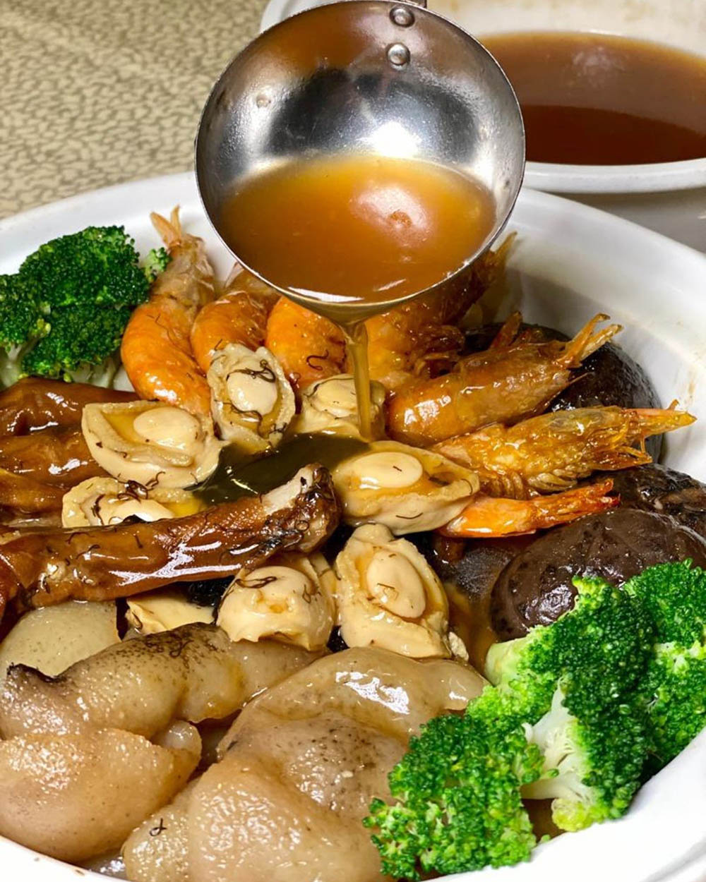 Overseas Restaurant has unveiled a range of Chinese New Year prosperity abalone treasure pot set menus. — Picture courtesy of the Overseas Malaysia's Facebook page