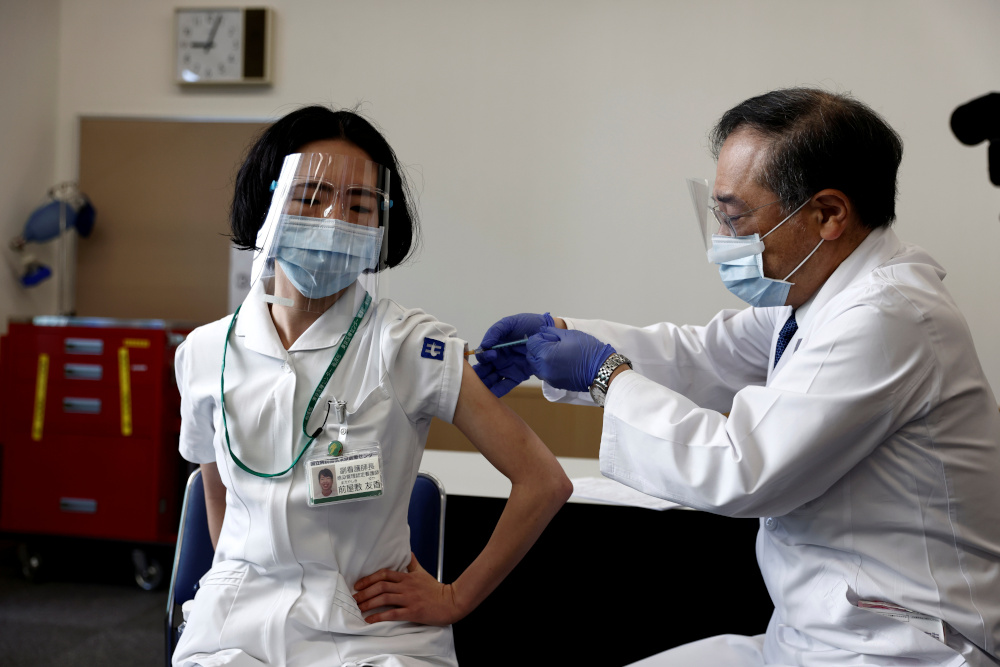A medical worker receives a dose of the coronavirus disease vaccine as the country launches its inoculation campaign, in Tokyo, Japan February 17, 2021. u00e2u20acu201d Reuters pic 