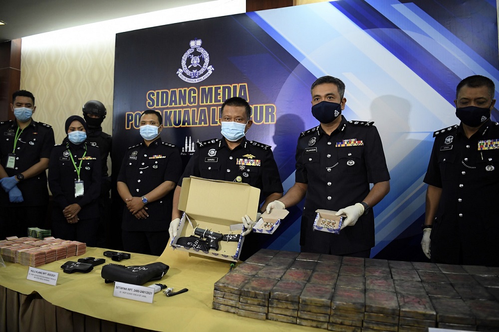 Bukit Aman Narcotics Criminal Investigation Department deputy director (Forfeiture of Property/Legal/Detention) Datuk Kamarul Zaman Mamat (third right) during a press conference in Kuala Lumpur February 23, 2021. u00e2u20acu201d Bernama pic
