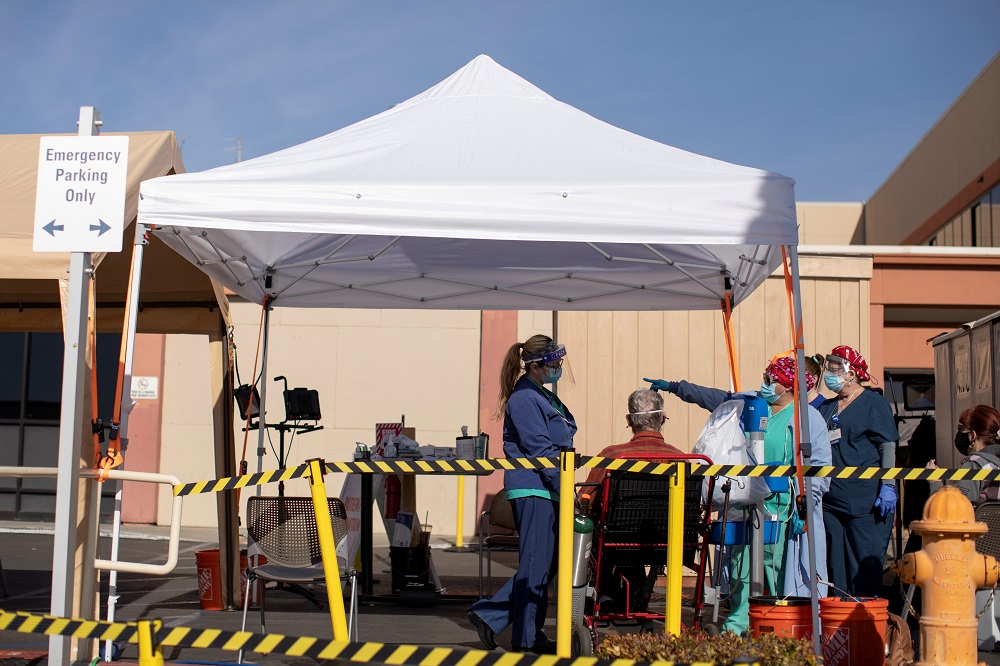 Healthcare workers attend to a patient as St. Mary Medical Center resorts to using triage tents outside to handle the overflow at its 200 bed hospital during the outbreak of Covid-19) in Apple Valley, California January 12, 2021. u00e2u20acu2022 Reuters pic