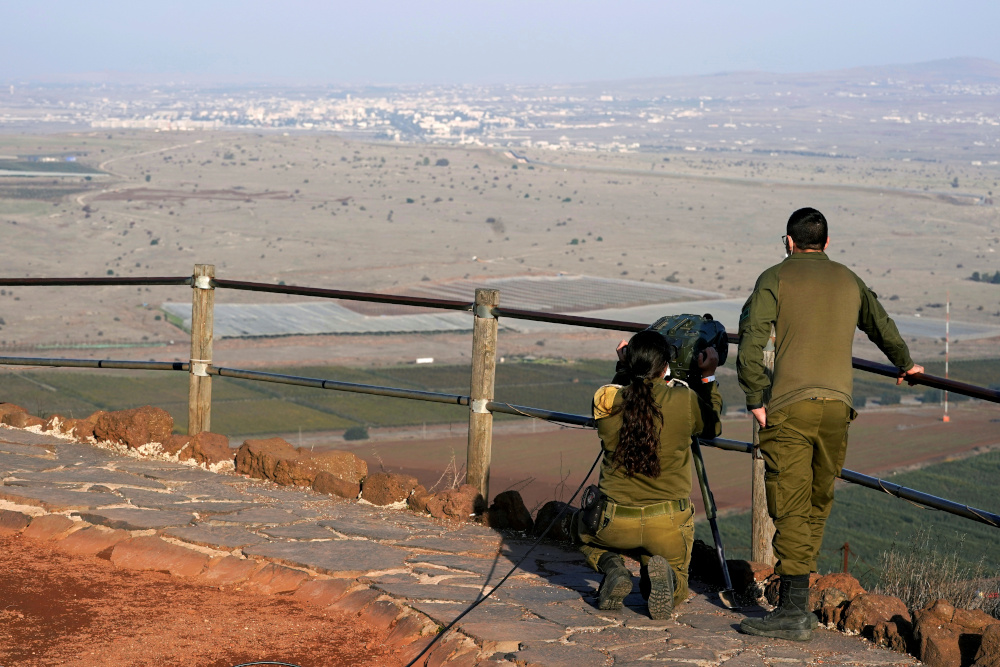Israeli soldiers look towards Syria across the border from Mount Bental in the Israeli-occupied Golan Heights November 19, 2020. u00e2u20acu201d Reuters pic 