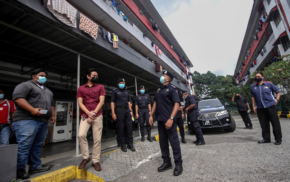 Johor police chief Datuk Ayob Khan Mydin Pitchay (centre) inspecting the SOP compliance in dormitory blocks housing Covid-19 positive workers in the Pasir Gudang Industrial Area in Pasir Gudang, February 1, 2021. u00e2u20acu201d Picture by Ben Tan
