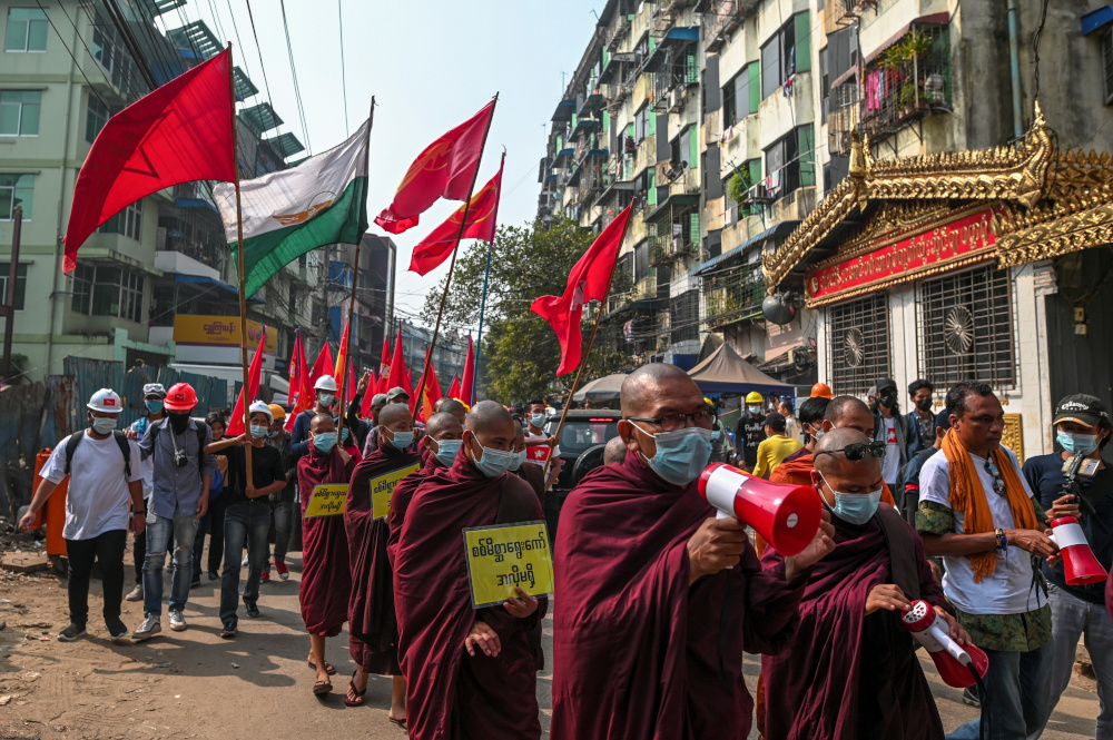 Buddhist monks and demonstrators rally against the military coup and to show their support to local residents after riot police officers used teargas to disperse a crowd in Yangonu00e2u20acu2122s Tamwe neighbourhood, Myanmar, February 26, 2021. u00e2u20acu201d Reuters pic 