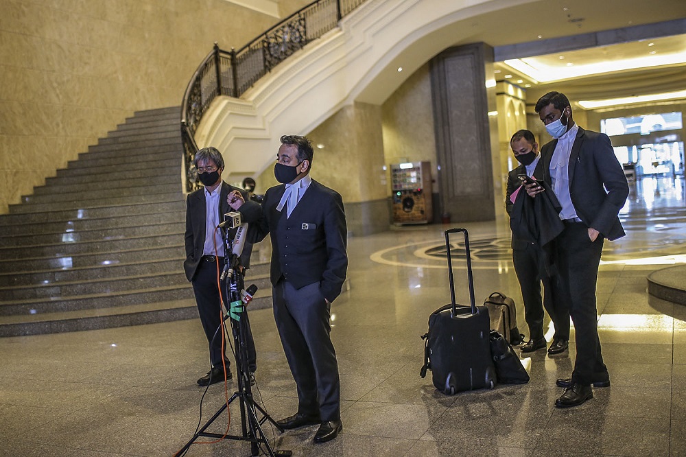 Malaysiakini's lead counsel Datuk Malik Imtiaz Sarwar speaks to reporters at the Federal Court in Putrajaya February 19, 2021. ― Picture by Hari Anggara