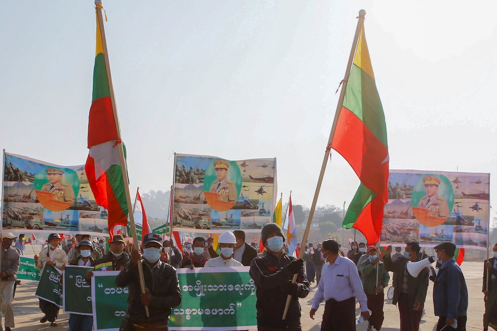 Military supporters carry portraits of junta leader General Min Aung Hlaing as they celebrate the coup in Naypyitaw, Myanmar February 4, 2021. u00e2u20acu201d Reuters pic