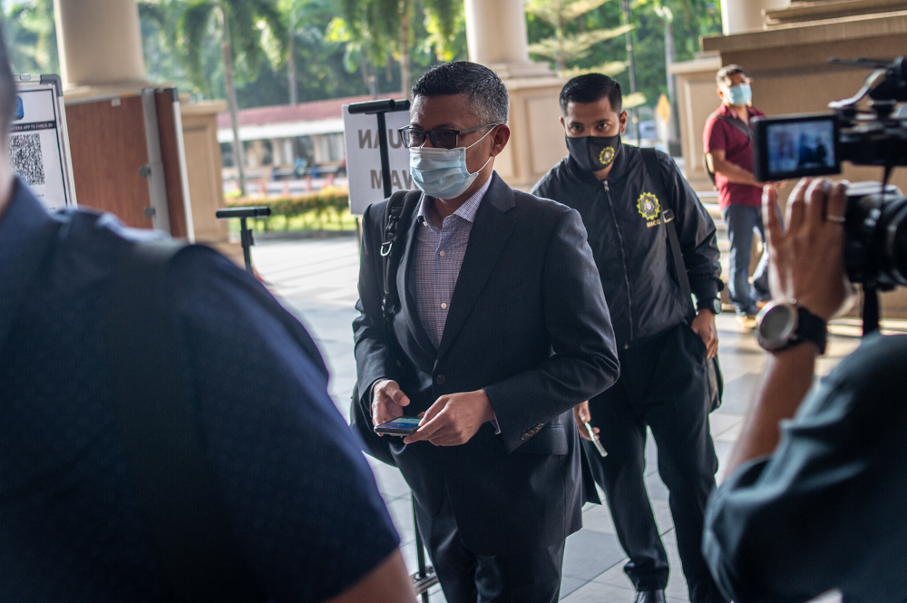 Former 1Malaysia Development Bhd (1MDB) chief executive officer Mohd Hazem Abdul Rahman arrives at the Kuala Lumpur Court Complex February 15, 2021. — Picture by Shafwan Zaidon
