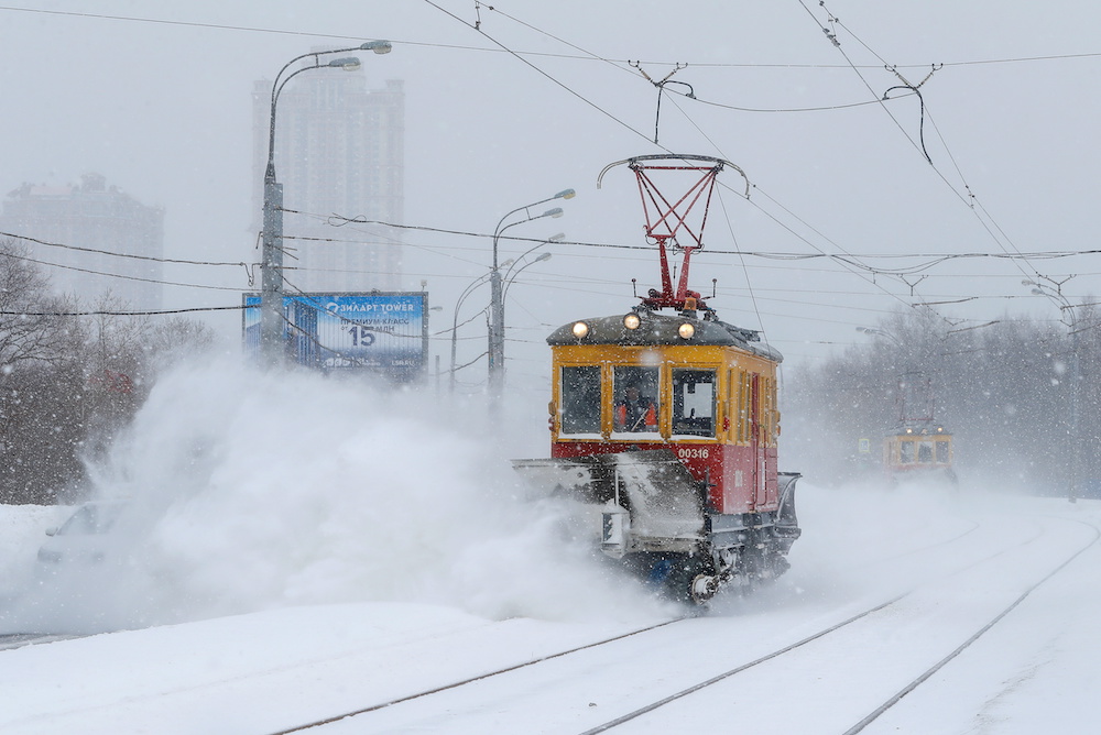 A maintenance tram removes snow from a track during heavy snowfall in Moscow, Russia February 13, 2021. .u00e2u20acu201d Reuters picnnn
