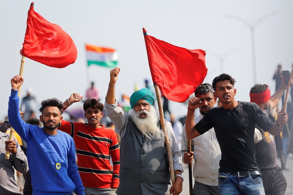Farmers shout slogans as they take part in a three-hour u00e2u20acu02dcchakka jamu00e2u20acu2122 or road blockade, as part of protests against farm laws on a highway on the outskirts of New Delhi, India, February 6, 2021. u00e2u20acu2022 Reuters pic