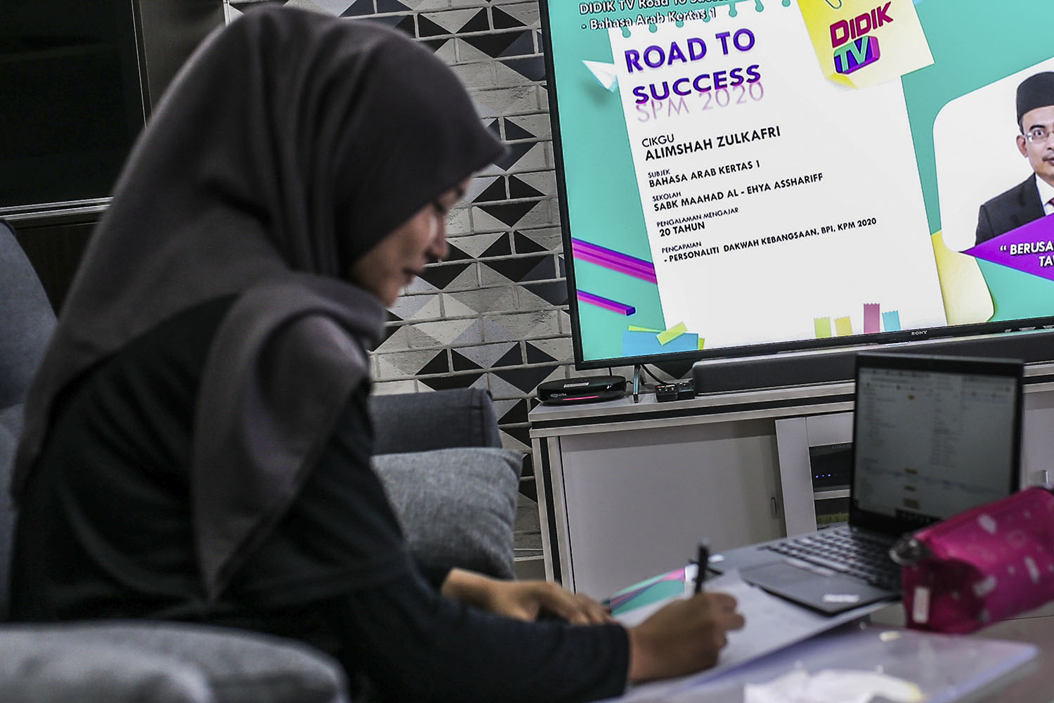 SPM student Nurul Ain learning after the launch of Didik TV by the Prime Minister, at her house in Wangsamas, Kuala Lumpur, February 17, 2021. The Ministry of Education creates the channel for education TV broadcasts. u00e2u20acu201d Picture by Hari Anggara