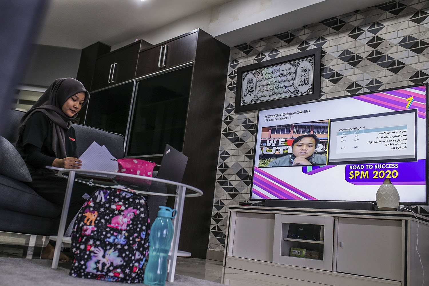 SPM student Nurul Ain learning after the launch of Didik TV by the Prime Minister, at her house in Wangsamas, Kuala Lumpur, February 17, 2021. The Ministry of Education creates the channel for education TV broadcasts. u00e2u20acu201d Picture by Hari Anggara