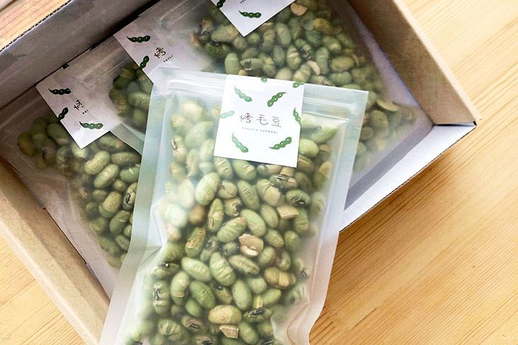 A box of roasted edamame is perfect for snacking.