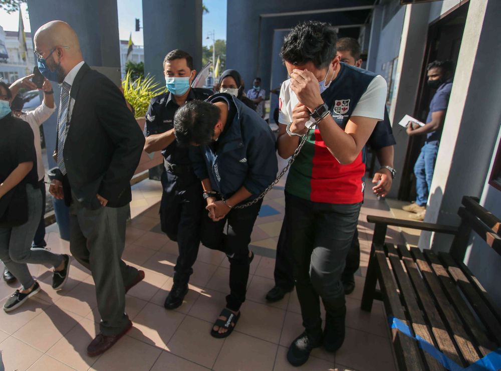 Reduan Ismail and Adan Ibrahim arrive at Ipoh Magistrateu00e2u20acu2122s Court February 2, 2021. u00e2u20acu201d Picture by Farhan Najib