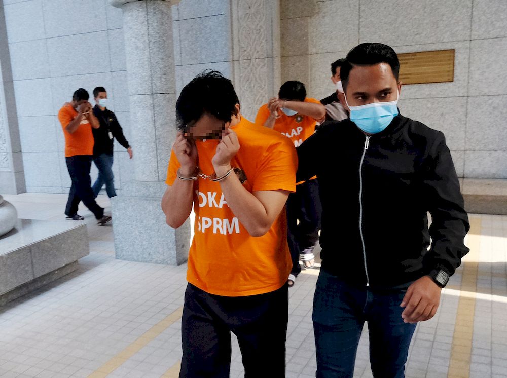 Three individuals were remanded for six days to assist in the investigation of a revenue stamp sales syndicate involving government revenue losses in excess of RM15 million, Putrajaya, February 18, 2021. u00e2u20acu201d Bernama pic