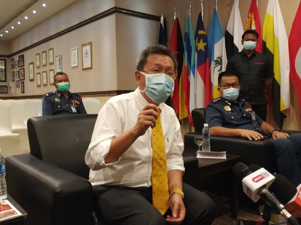 Sarawak Minister of Local Government and Housing Datuk Seri Dr Sim Kui Hian speaks to reporters in Kuching February 10, 2021. u00e2u20acu201d Picture by Sulok Tawienn