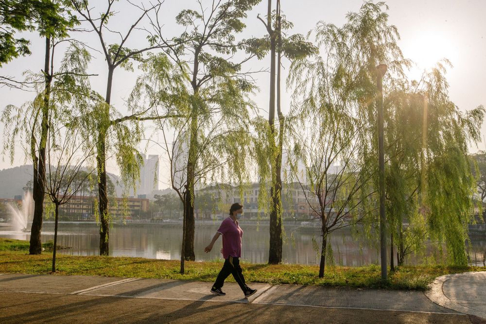 A woman is seen taking a walk at the Sri Rampai Lake Park in Kuala Lumpur February 24, 2021. u00e2u20acu201d Picture by Firdaus Latifnn