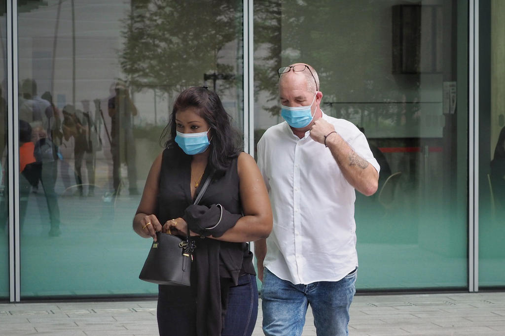 Nigel Skea (right), 52, and Agatha Maghesh Eyamalai, 39, are seen outside the court on February 15, 2021. u00e2u20acu2022 TODAY pic