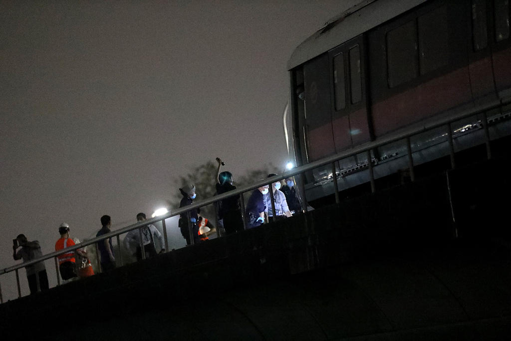 Police are seen along the train tracks between Kallang and Lavender MRT stations on February 25, 2021. u00e2u20acu2022 TODAY pic