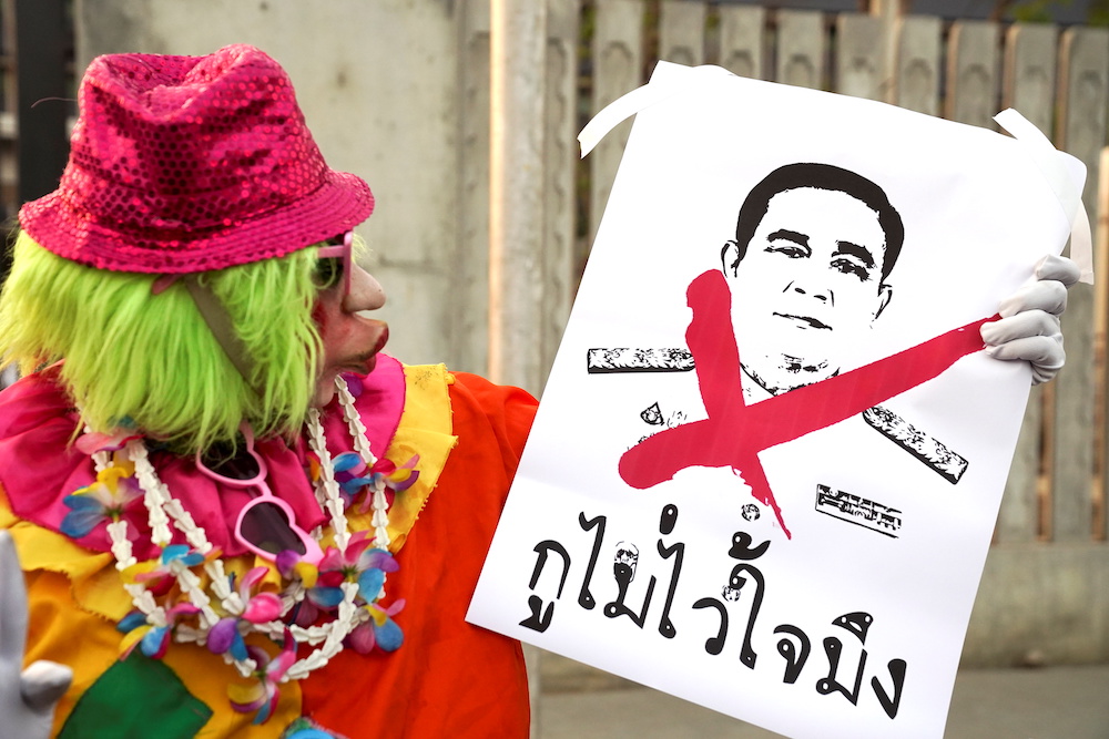 A pro-democracy protester holds a placard during a rally after Thailandu00e2u20acu2122s Prime Minister Prayuth Chan-ocha and nine ministers survived no-confidence debates, outside the Parliament in Bangkok, Thailand, February 20, 2021. u00e2u20acu201d Reuters picnn