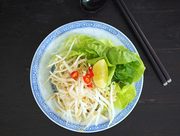 Squeeze the lime over the noodles to give it a refreshing taste while the crunchy bean sprouts will give it texture and more freshness.