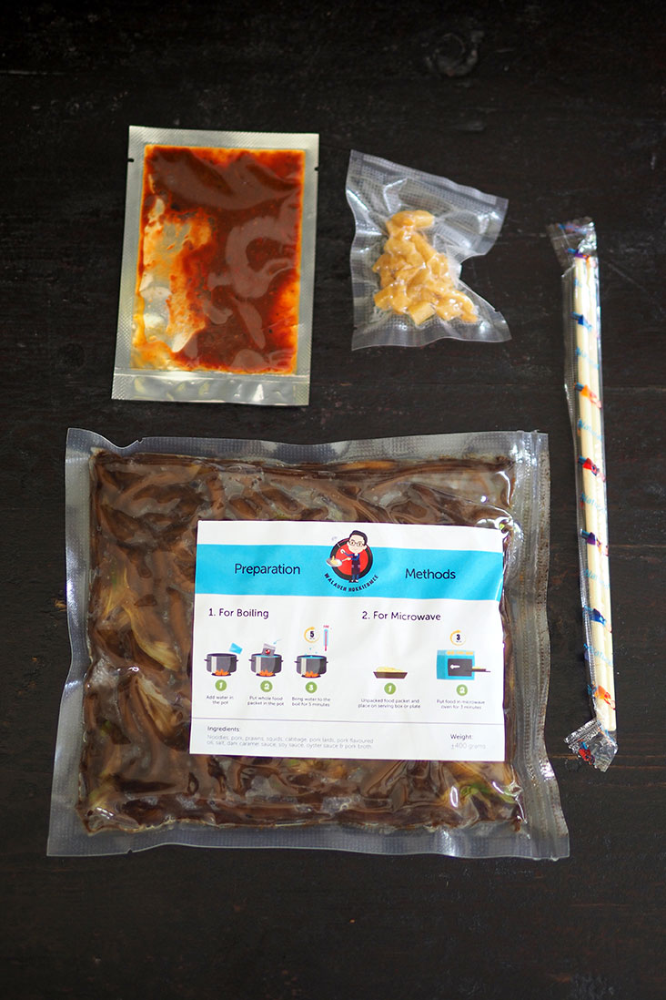Your box comes with the noodles packed in a bag, 'sambal' in a small pouch, lard fritters vacuum packed and a pair of chopsticks