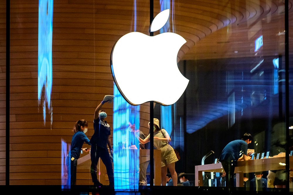 The Apple logo is seen on a window of the company's store in Bangkok. u00e2u20acu2022 AFP pic via ETX Studio
