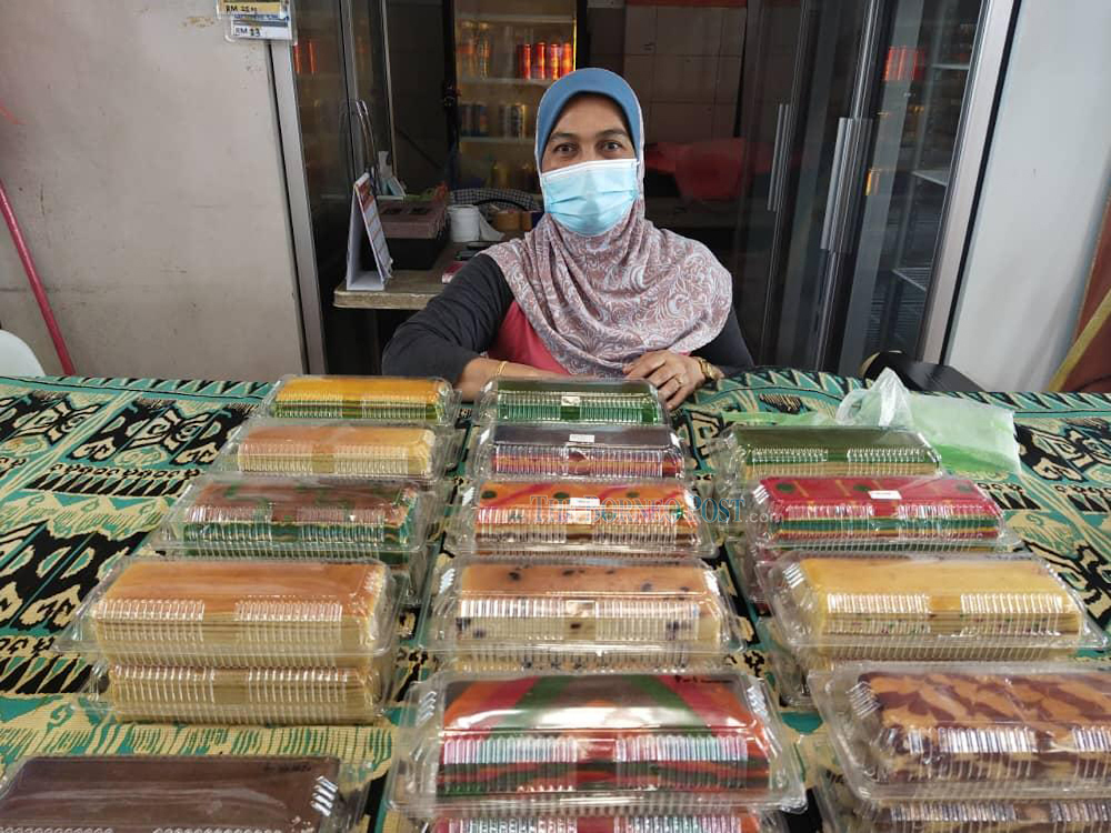 Dayang Norhajijah seen with her layer cakes at her shop in Kubah Ria on Sunday. u00e2u20acu201d Borneo Post Online picnn