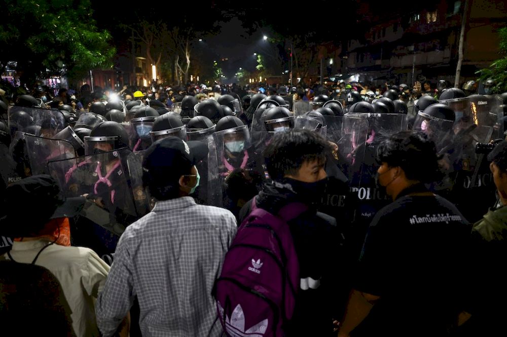Pro-democracy protesters face off with riot police during a rally demanding the end of Thailandu00e2u20acu2122s royal defamation law in Bangkok on February 10, 2021. u00e2u20acu201d AFP pic