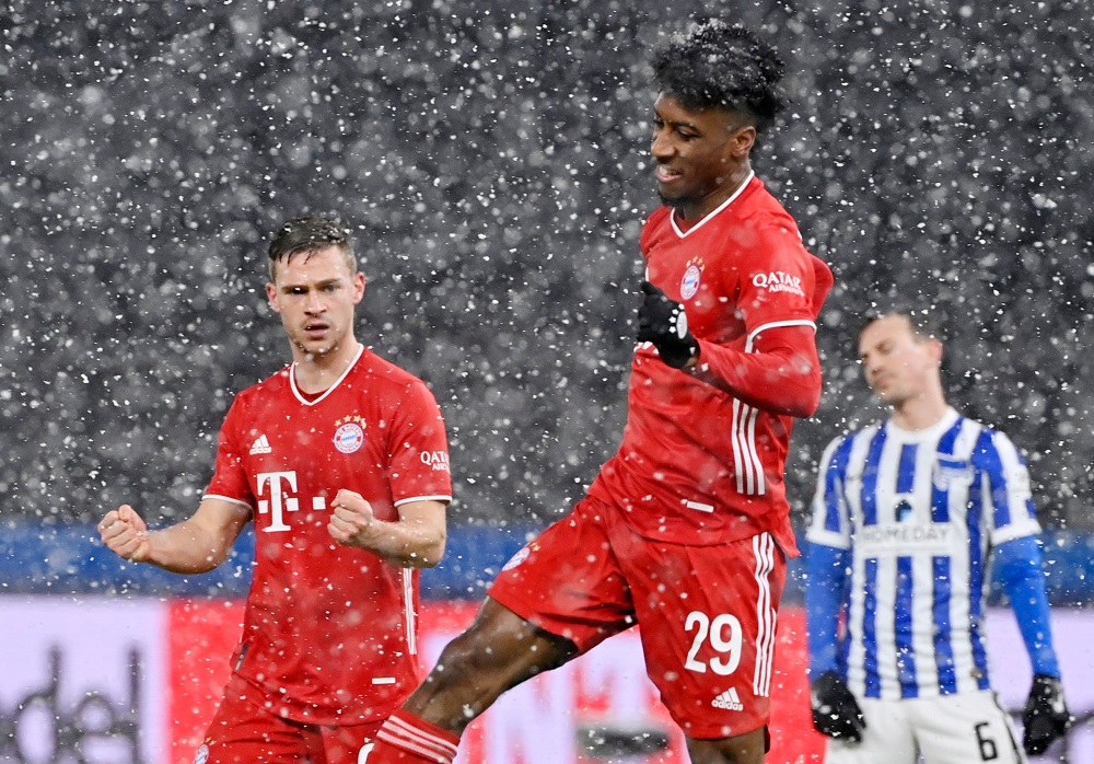 Bayern Munich's Kingsley Coman celebrates with Joshua Kimmich after scoring the first goal against Hertha BSC February 6, 2021. u00e2u20acu2022 Pool via Reuters