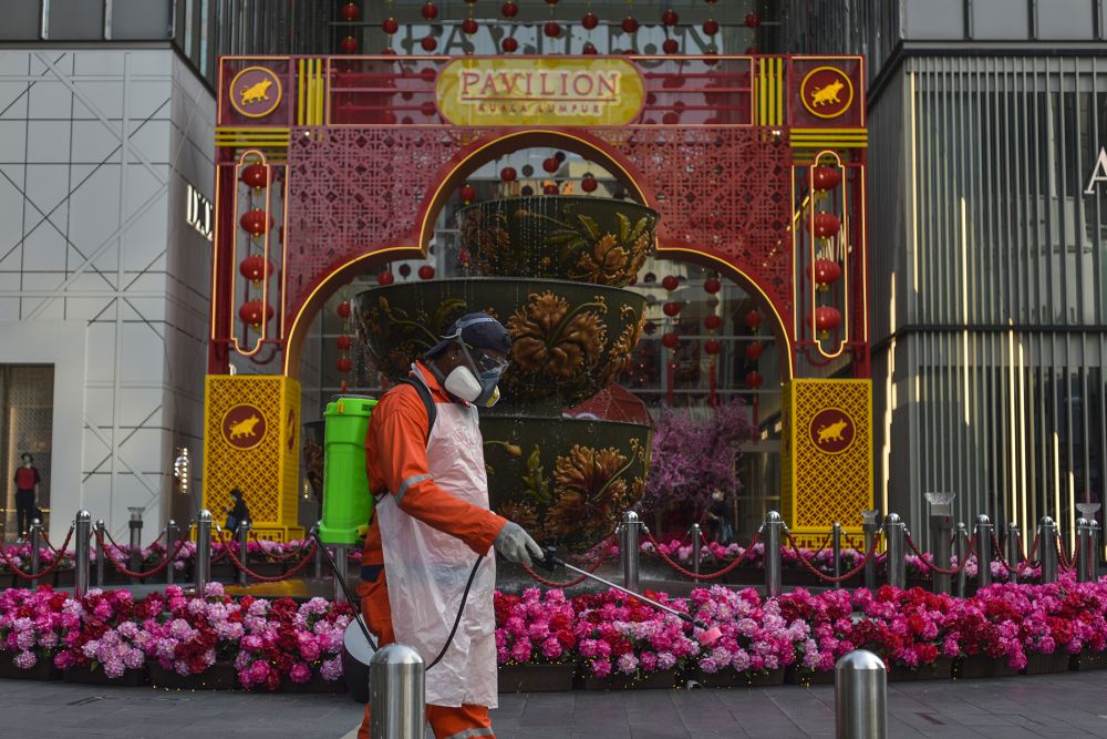 A DBKL worker sprays near Pavilion Kuala Lumpur February 3, 2021. u00e2u20acu201d Picture by Miera Zulyana