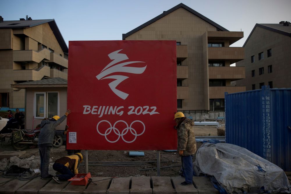 Workers move a sign at the Olympic Village for the 2022 Winter Olympics in the Chongli district of Zhangjiakou, Hebei province October 29, 2020. u00e2u20acu2022 Reuters pic