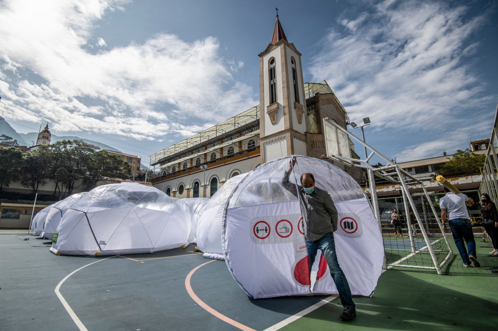 A man comes out of a plastic dome rural hospital built to isolate Covid-19 patients during an inspection, in Bogota February 16, 2021. u00e2u20acu201d AFP picnn