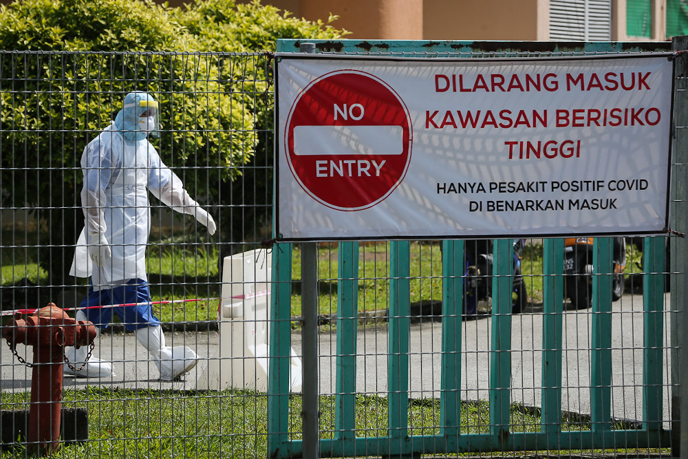 A Health worker wearing personal protective equipment is seen at the entrance of Covid-19 Assessment Centres (CAC) at Stadium Hoki Pandamaran in Klang February 2, 2021. u00e2u20acu201d Picture by Yusof Mat Isa