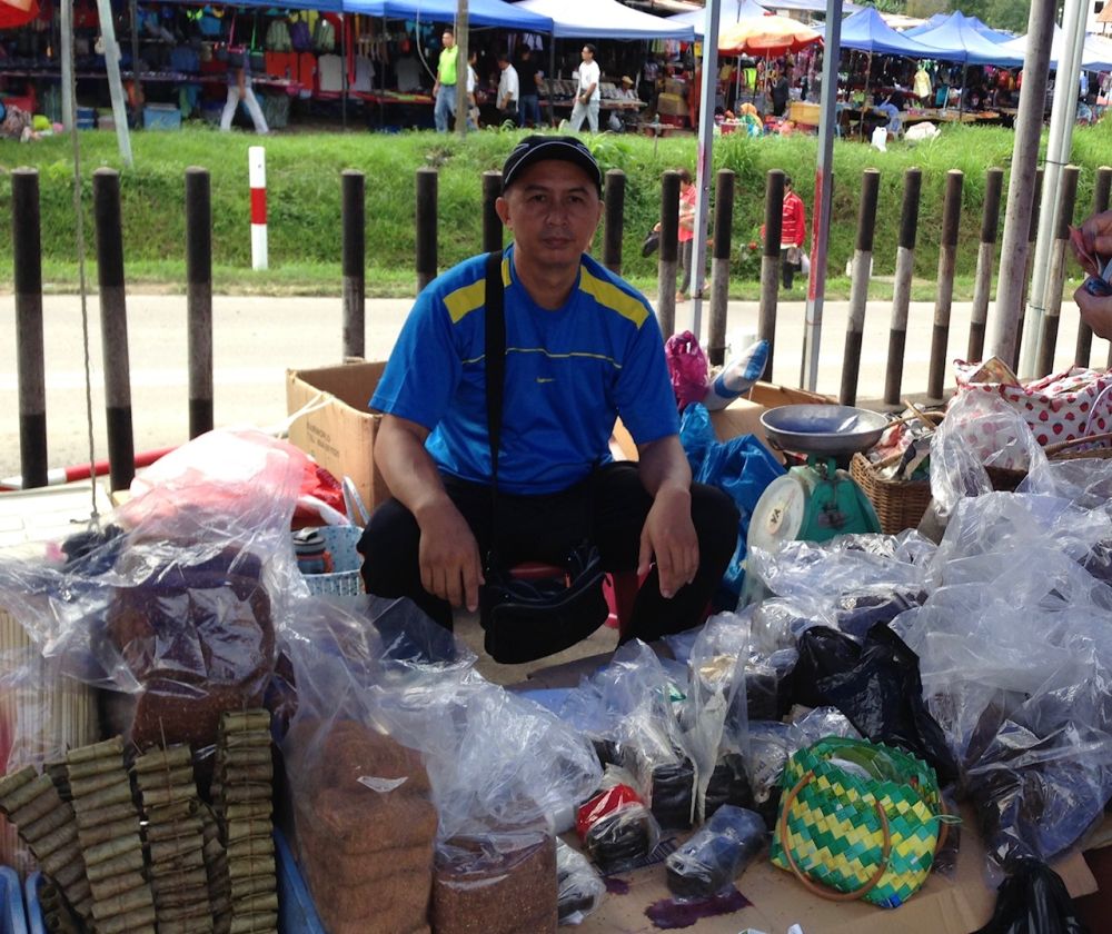 Norbert Juakim, 46, a tobacco trader, said the vaccine would prove useful in the absence of cure for now. — Picture by Julia Chan
