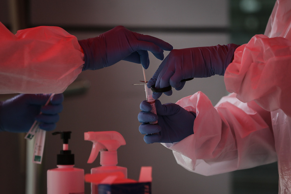 Health workers collect swab samples to test for Covid-19 at Selcare Clinic in Shah Alam February 2, 2021. u00e2u20acu201d Picture by Yusof Mat Isa