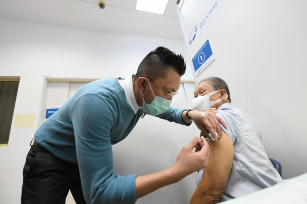 A taxi driver identified only as Tham, 72, was among the first taxi drivers to receive the Covid-19 vaccination February 23, 2021. u00e2u20acu201d Ministry of Transport handout pic via TODAY 